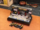1:64 race diorama with figures and pit equipment