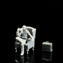 1:64 seated figure with chair and props